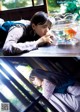 A woman laying on a window sill next to a fish bowl.