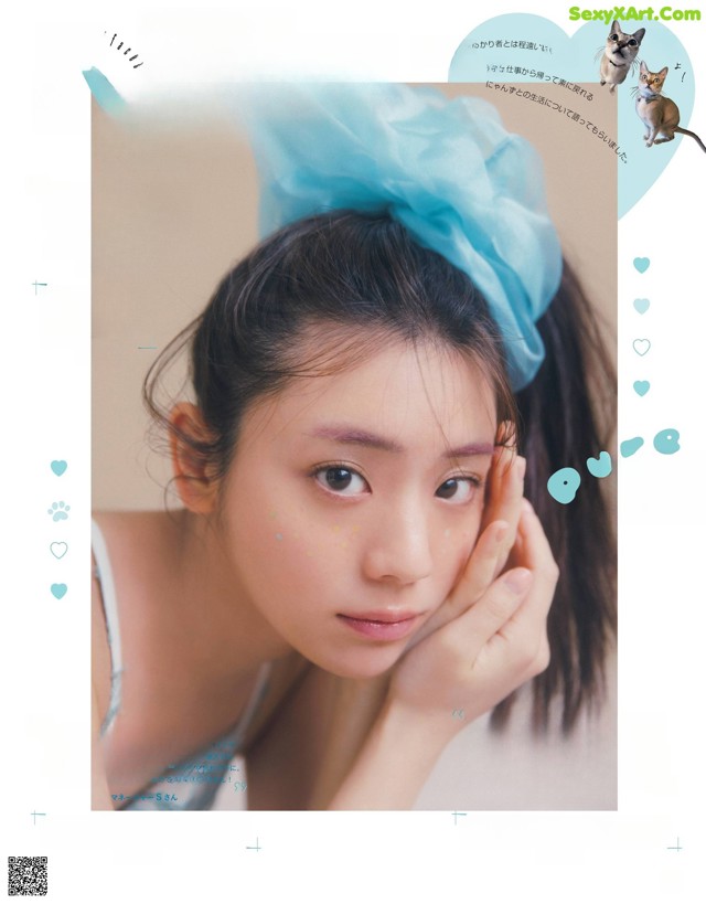 A woman with a blue bow on her head in a magazine.